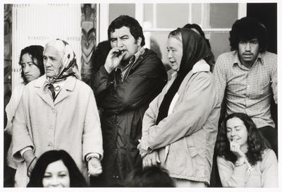 Porch Tukaki wharenui, Te Kaha-nui-a-tiki marae, Te Kaha. Selwyn Muru with local kuia. June 1973