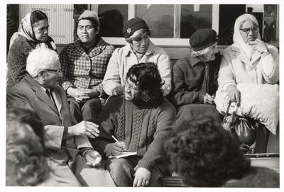 Porch, Tukaki wharenui. Te Kaha-nui-a-tiki marae, Te Kaha. Local kuia and Ringatu Pou Paora Delamere with Haare Tahapehi. June 1973