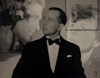 (Man in tuxedo with two montaged ephemeral female heads)