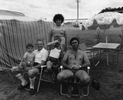 The Hibiscus Coast Project, Campers and Lifesavers: Family group with small sun umbrella