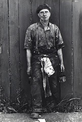 Man painting his fence