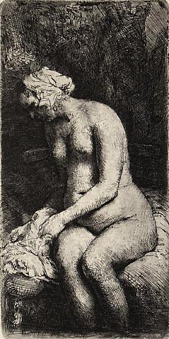 Woman bathing her feet at a brook