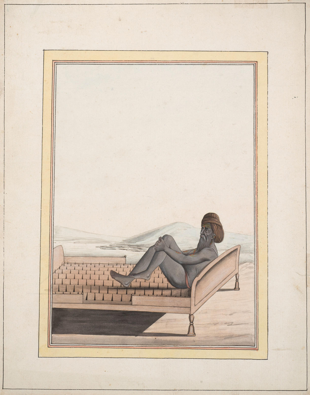 Sadhu lying on a bed of nails