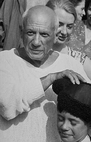 At the cafe - Picasso with Claude wearing Matador hat