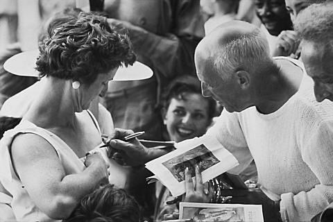 At the cafe - Picasso autographing a woman's dress