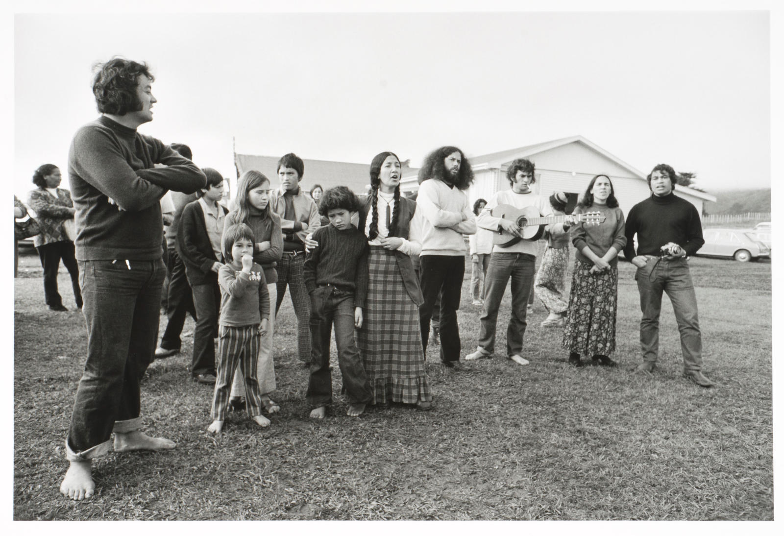 A waiata for departing friends Te Kaha-nui-a-tiki marae, Te Kaha. Syd Jackson, (?) Chris Sidney, Karen Sidney, Pura Jackson, Hana Jackson/Te Hemara, Brian/Morehu McDonald, Val Irwin, Ngahuia Volkering/Te Awekotuku, Haare Williams. Monday 4th June 1973