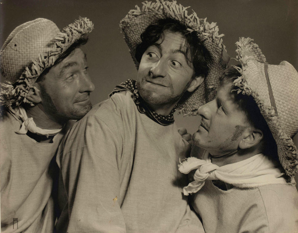 (Three men in "farmer" costumes)