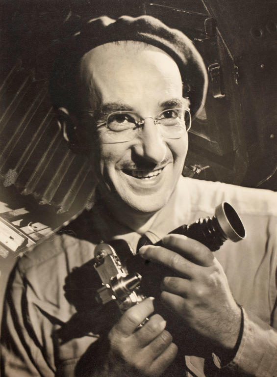 (Portrait of a man with camera)