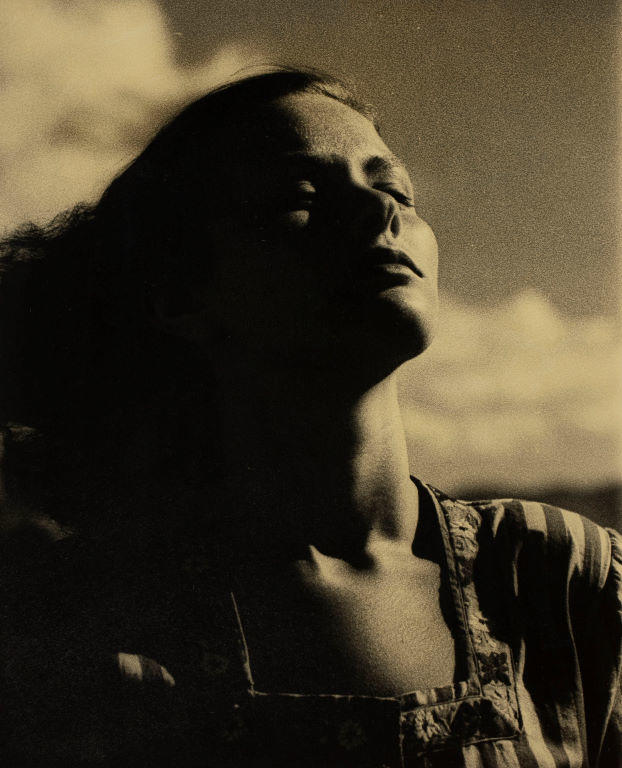 (Woman with face raised and eyes shut)