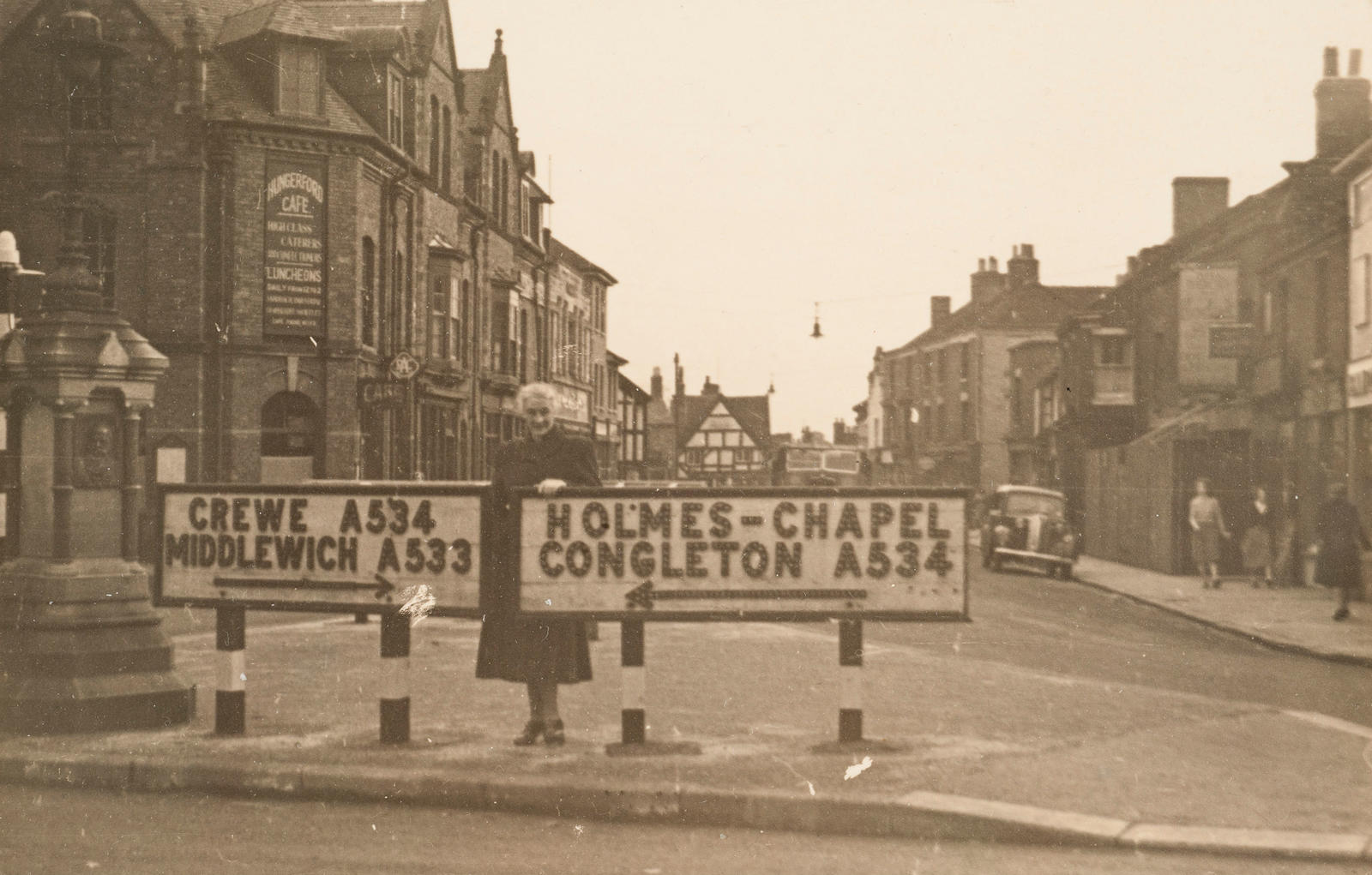 (Mary in Hungerford (?), U.K) Mary with road direction signs