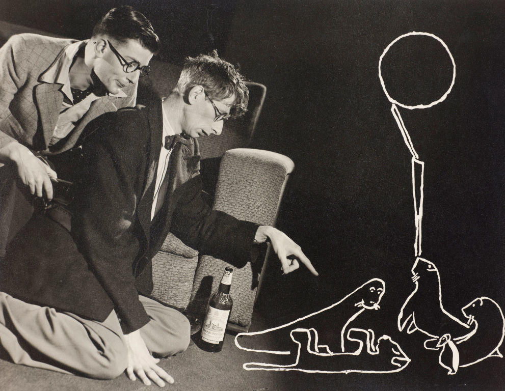 (Tableau of two drunk men, playing seals scratched into negative)