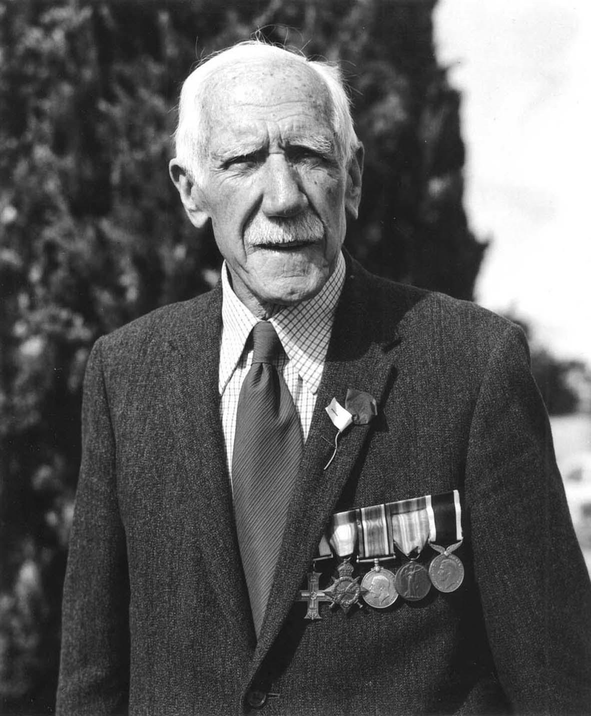 The Hibiscus Coast Project, ANZAC Day Veterans: Veteran With White Hair In Front Of Cyprus Tree