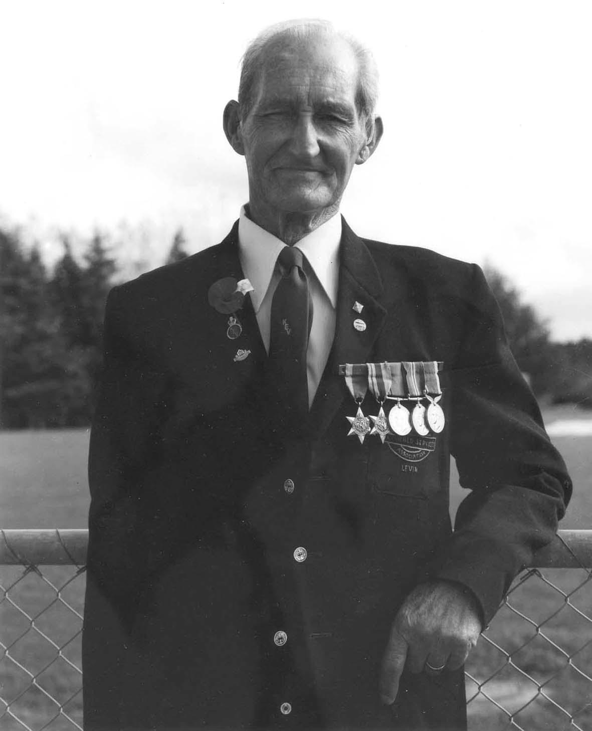 The Hibiscus Coast Project, ANZAC Day Veterans: Veteran Leaning Against Hurricane Fence